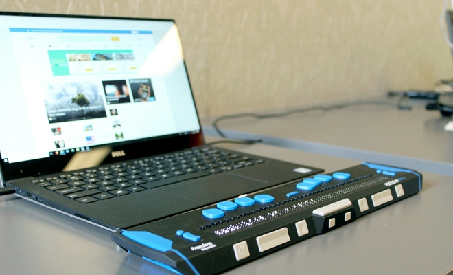 A computer with a refreshable braille display.